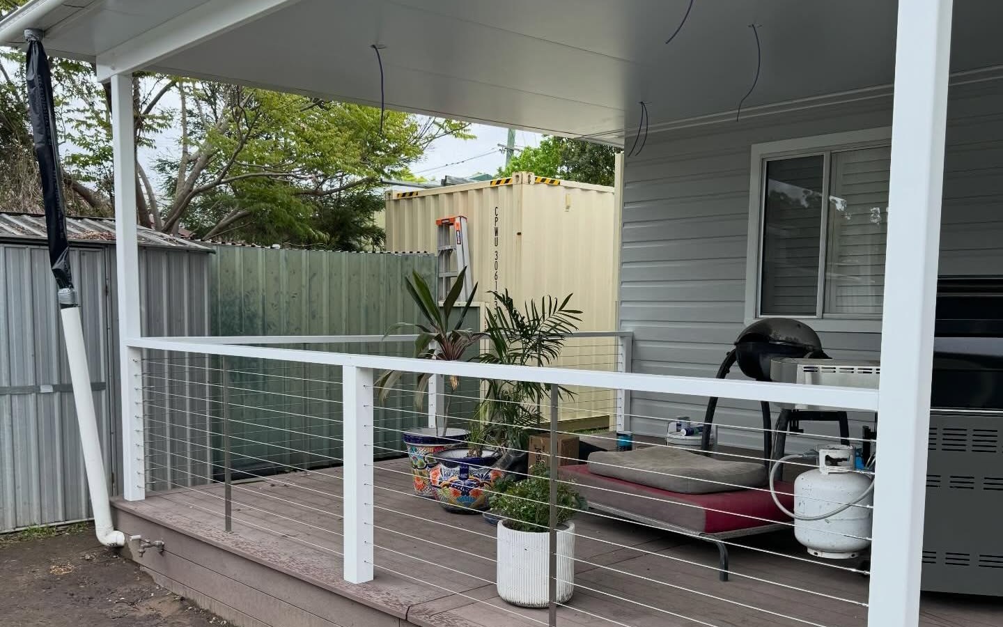 Cable-railing outdoor living deck