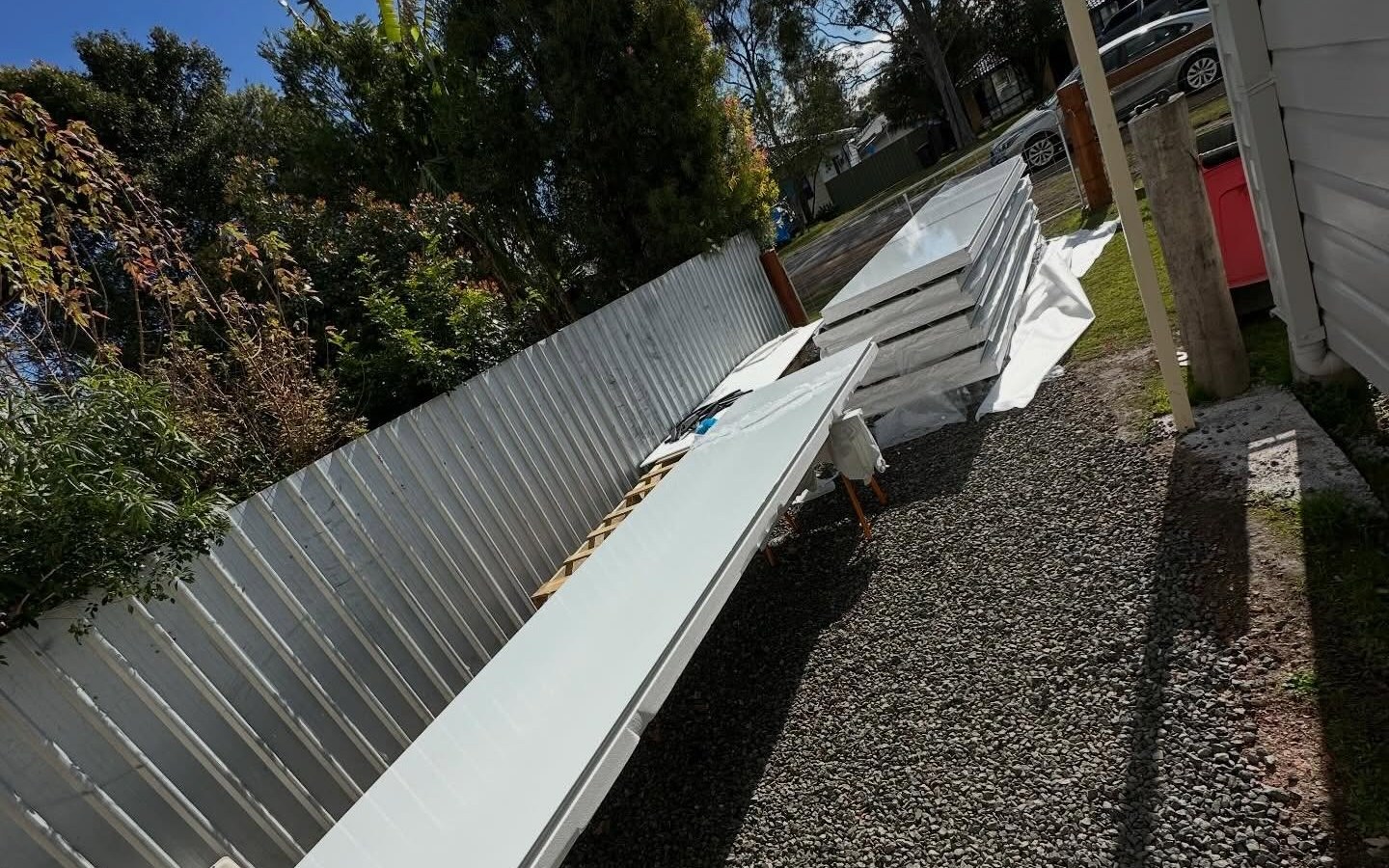 Versiclad insulated roof panels stacked on a Hunter building site